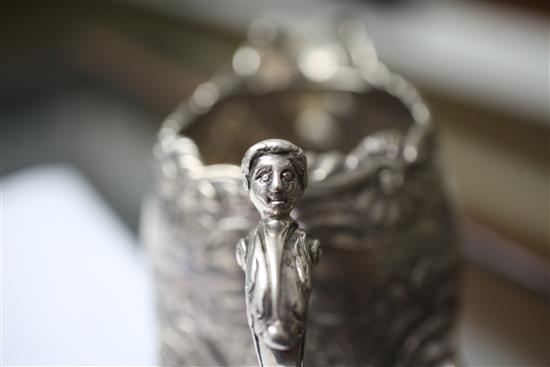 An ornate silver cream jug, 14.5 oz.